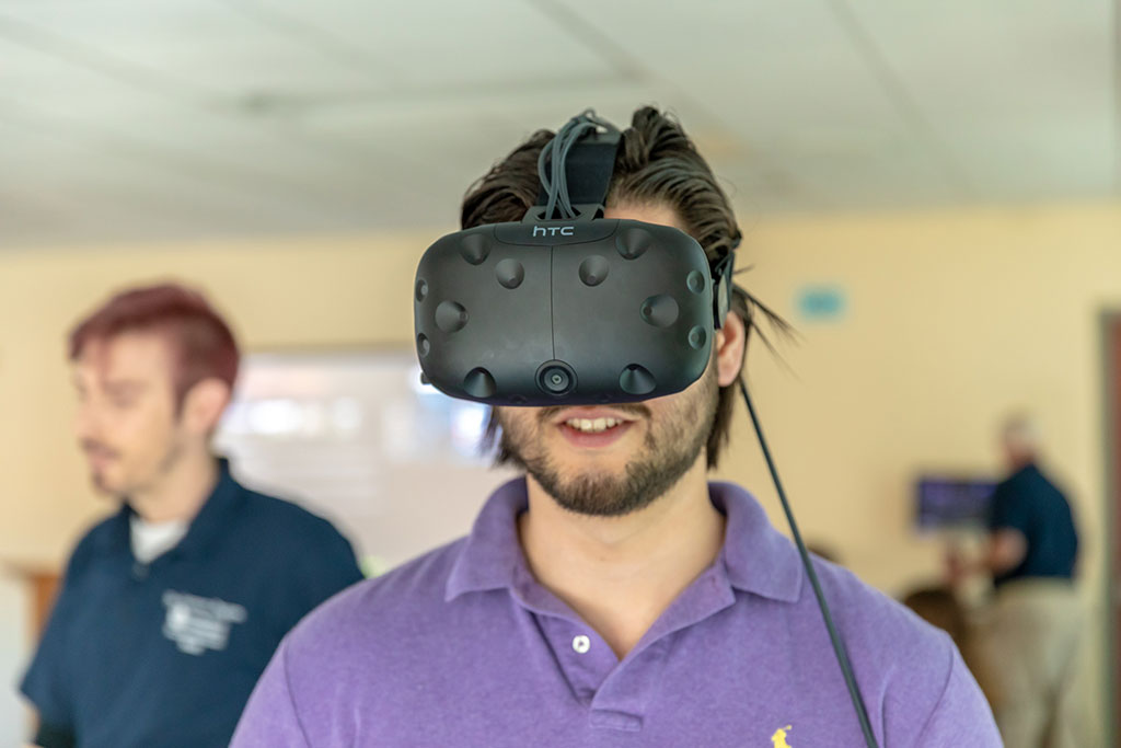 Student wearing VR headset.